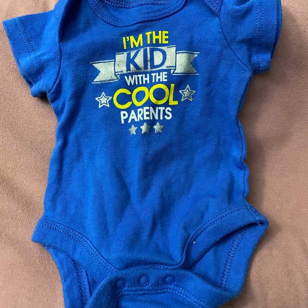 4/$10 I’m the kid with the cool parents onesie
